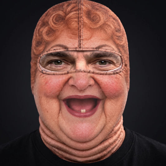 Person wearing the Aunt Bev ski mask, straight-on, real eyes visible through the open oval eye window.