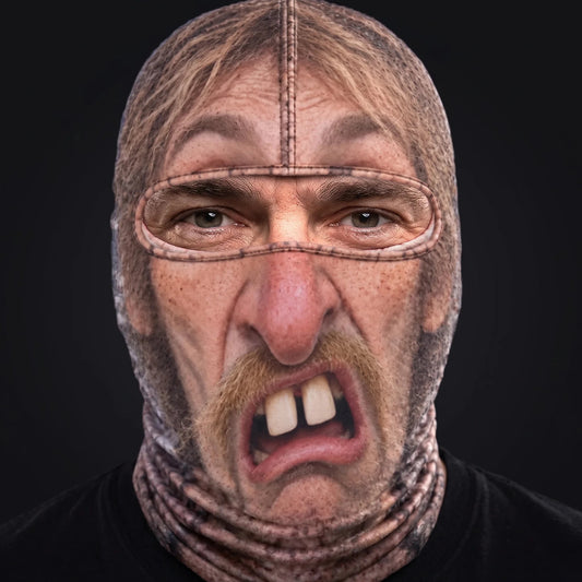 Person wearing the Cousin Wade ski mask, straight-on, real eyes visible through the open oval eye window.