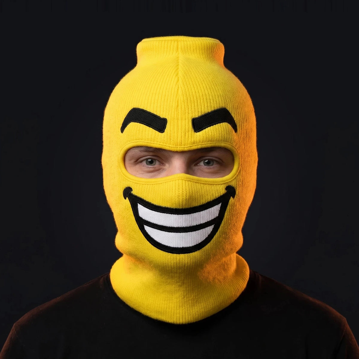 Person wearing the Beamer ski mask, straight-on, real eyes visible through the open eye opening.