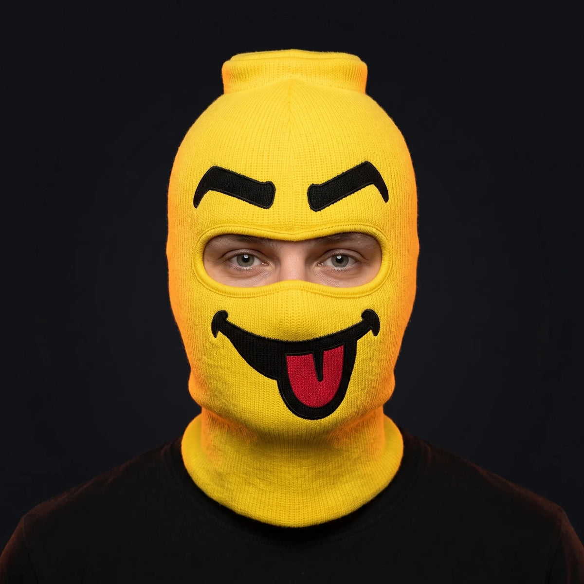 Person wearing the Blep ski mask, straight-on, real eyes visible through the open eye opening.