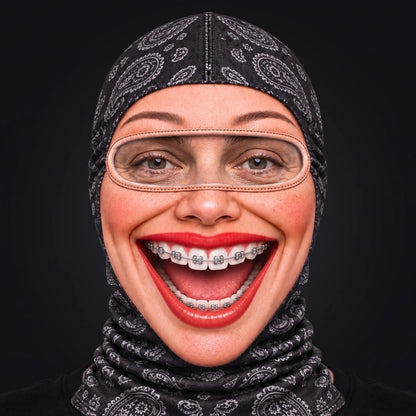 Person wearing the Brenda Braces ski mask, straight-on, real eyes visible through the open oval eye window.