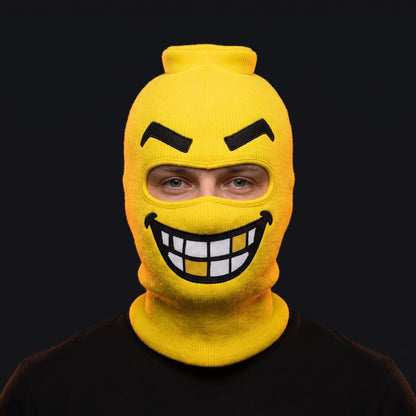 Person wearing the Chompers ski mask, straight-on, real eyes visible through the open eye opening.