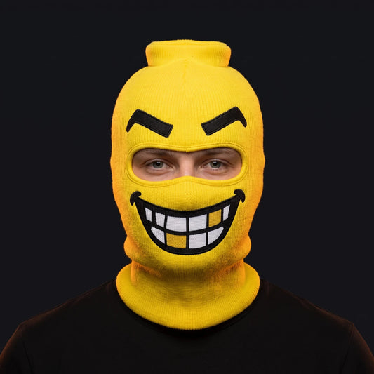 Person wearing the Chompers ski mask, straight-on, real eyes visible through the open eye opening.