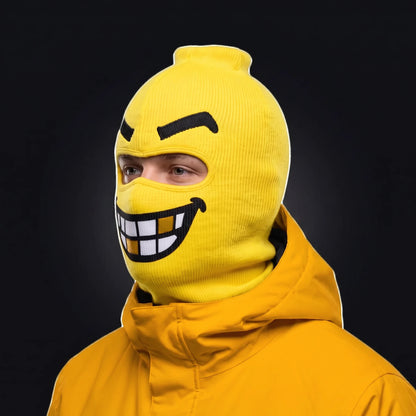 Three-quarter view of the Chompers ski mask pulled over the head, ears and neck, worn with a Goon Yellow jacket.